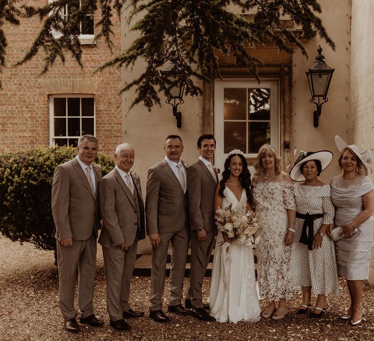 Bride and groom with members of the wedding party wedding guest fashion 