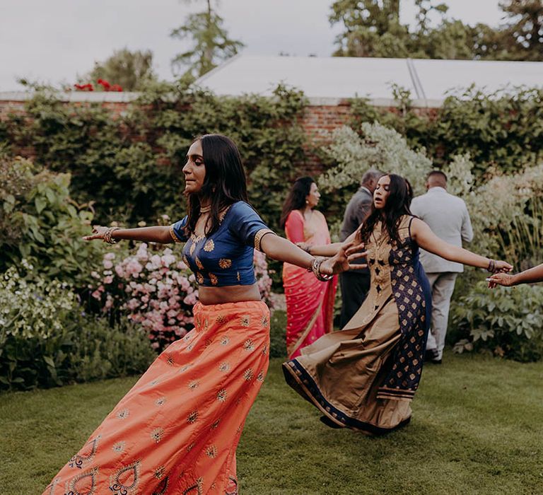 Dancers perform outdoors for Hindu wedding at Braxted Park Estate 