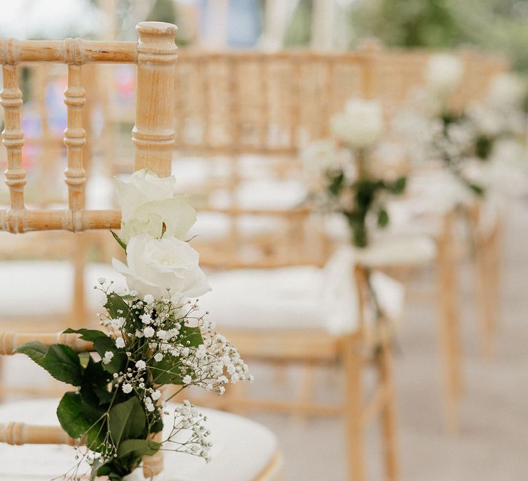 White rose and gypsophila wedding chair decor for a classic and traditional wedding 