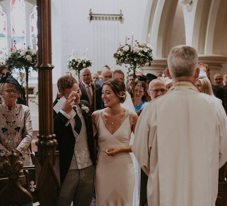 Groom becomes emotional during church wedding ceremony 