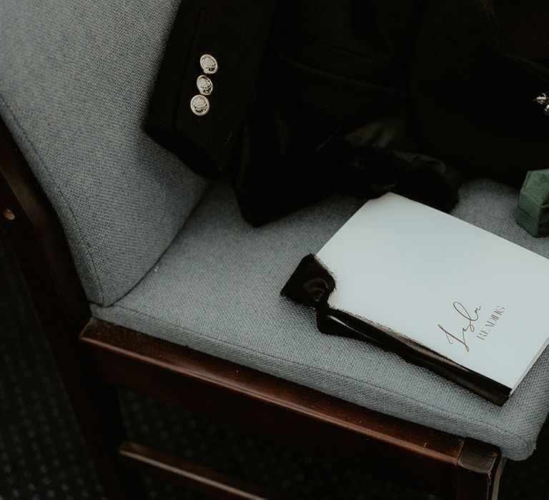 White booklet holding the bride and groom's daughter's wedding reading for the ceremony at Stroud Registry Office 