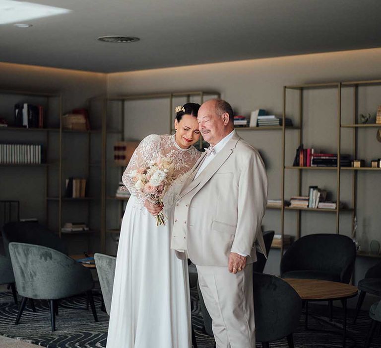 emotional father of the bride first look with bride in a boho wedding dress