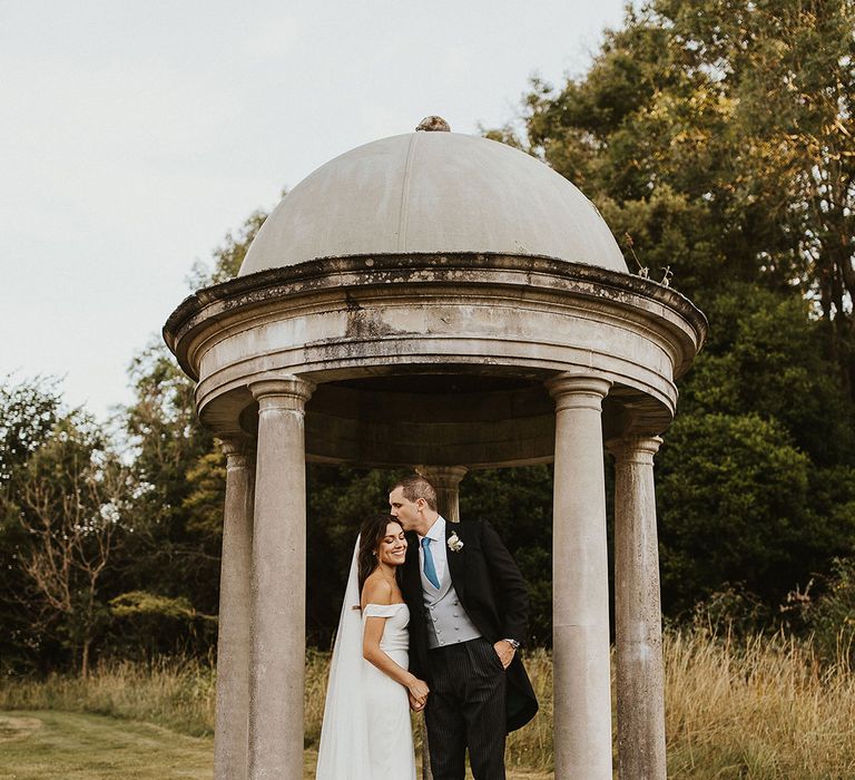 Came House wedding venue in Dorset with the bride and groom in classic and traditional wedding outfits