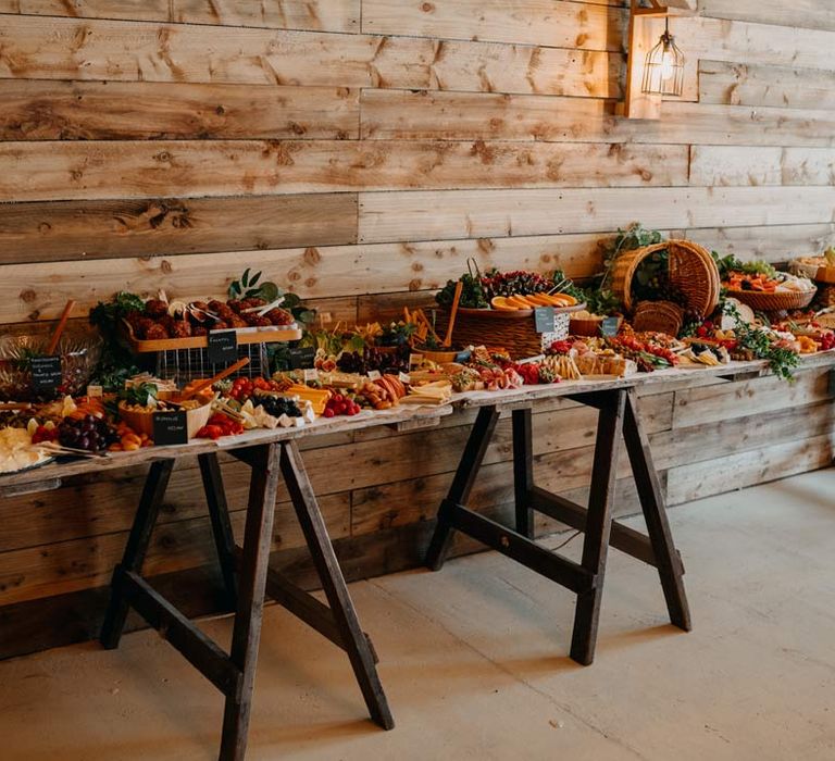 Large wedding grazing table at Southlands Barn rock and roll themed wedding