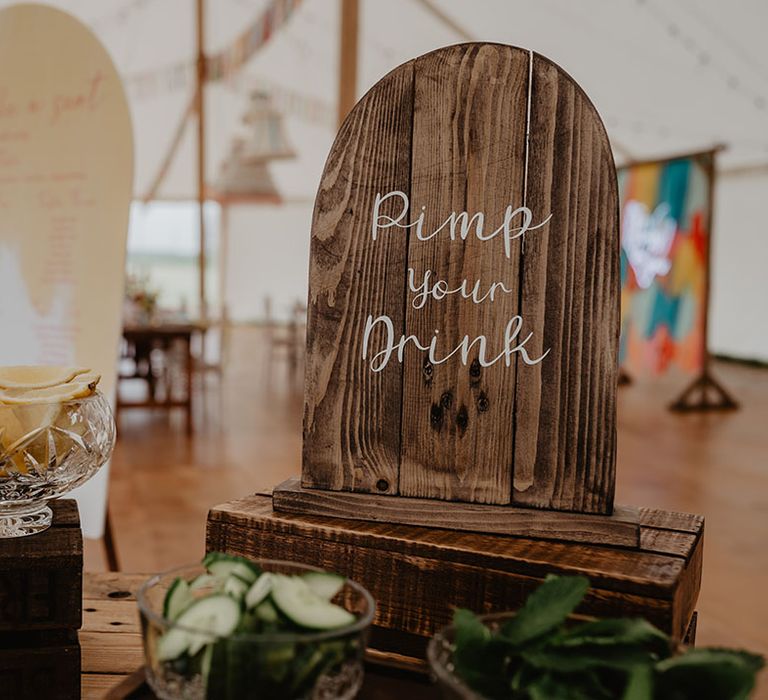 Pimp your drink station for guests to use to jazz up their alcoholic drinks with wooden boho signage 