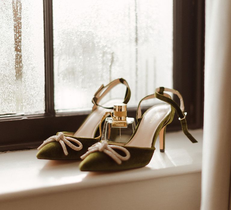 Green wedding shoes with bow detailing with Chloe wedding perfume 