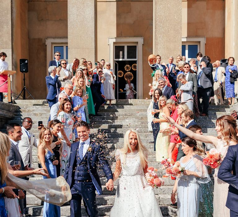 Confetti exit for the bride and groom at their wedding in Hampshire 