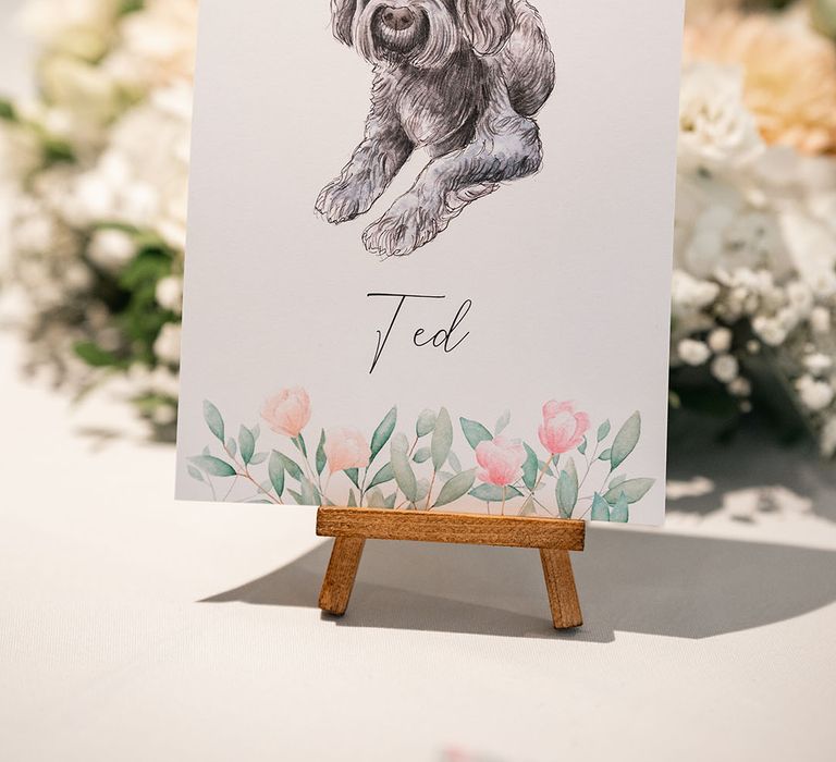 Drawn wedding table name sing with dog