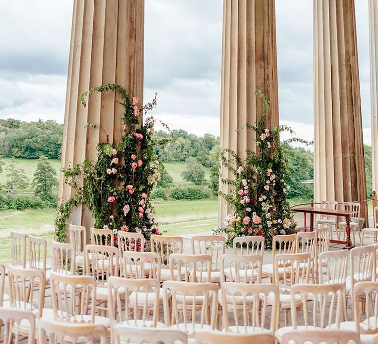 Pink flower columns decorating The Grange in Hampshire wedding venue 