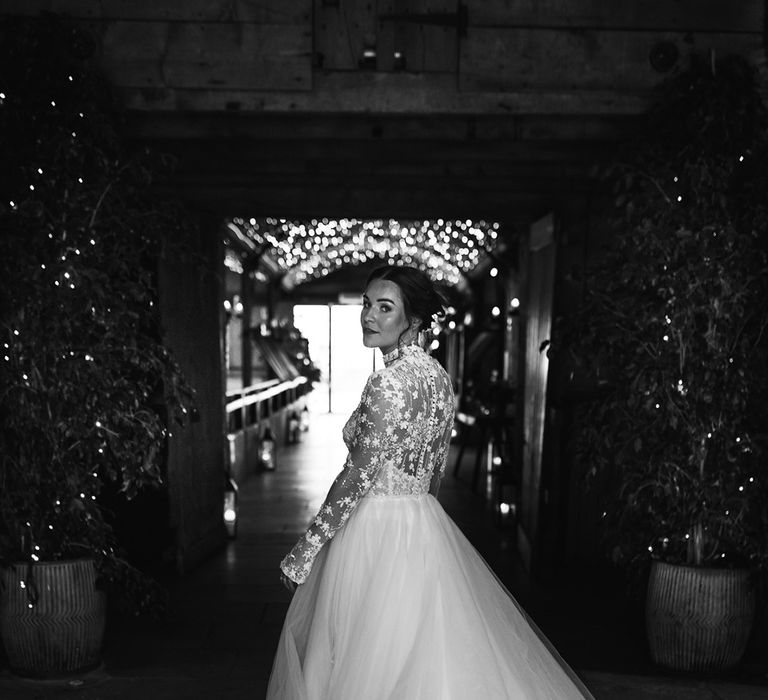 Bride in floral long sleeve high neck wedding dress with tulle skirt 