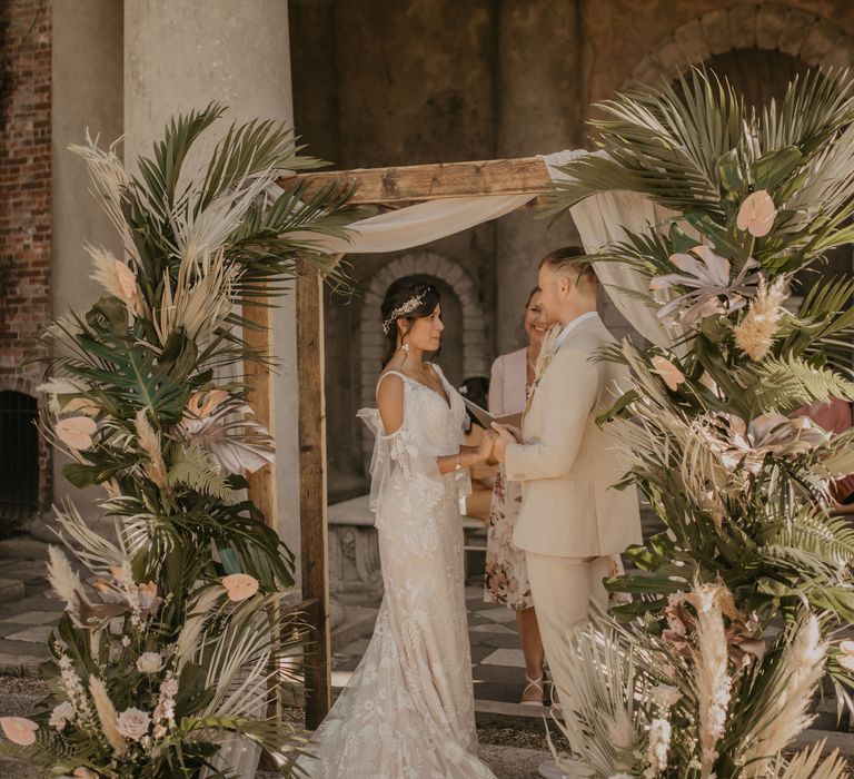 Altar decorated in tropical flowers for wedding ceremony