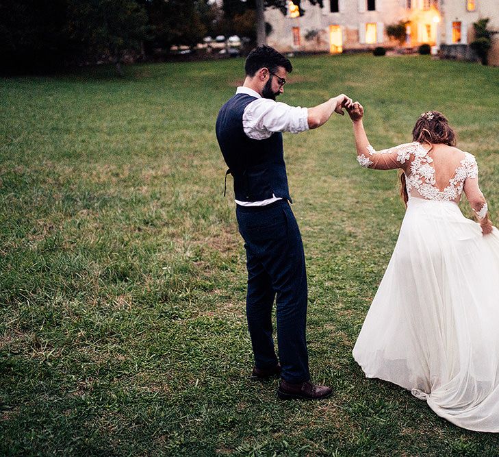 Bride in bespoke wedding dress for French wedding with groom