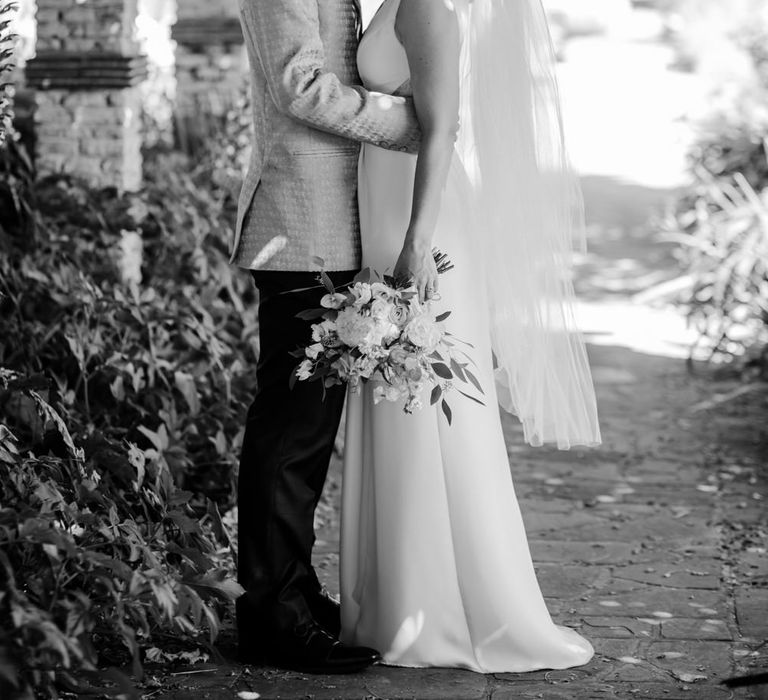 Portrait of bride and groom kissing at micro wedding 