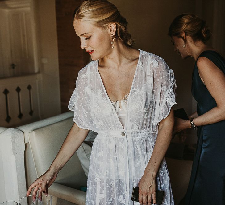 Bride in lace underwear and getting ready robes 