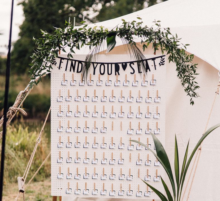 Peg board wedding table plan for a budget wedding