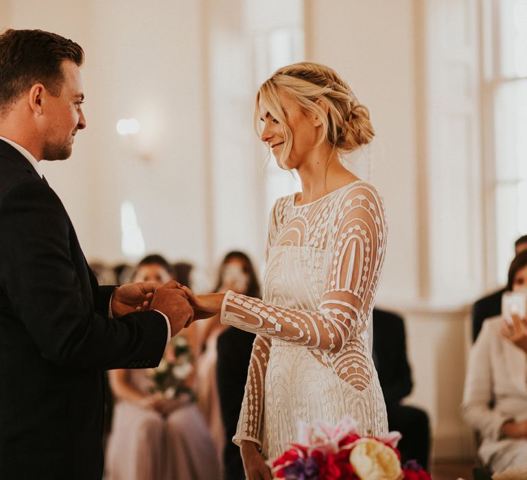 Bride and groom exchanging rings during their civil ceremony 