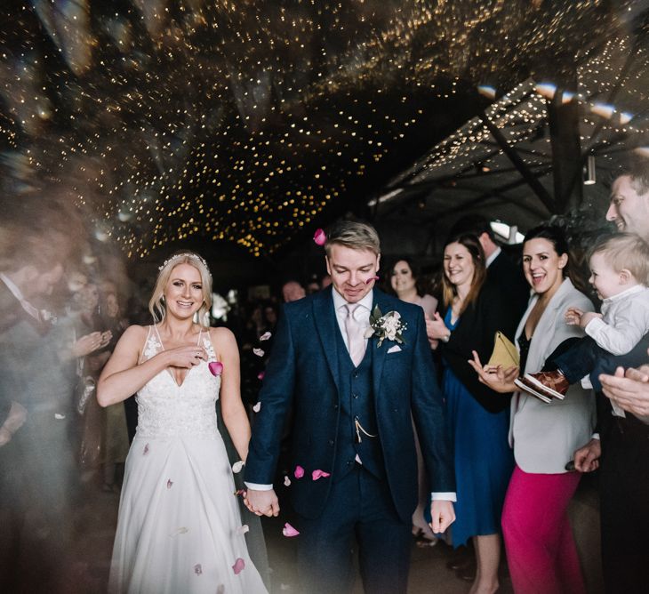 Bride and groom at their Cotswold barn wedding