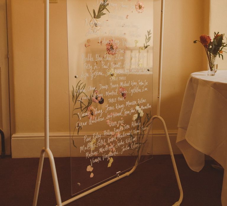 Acrylic table plan with flower pressed design 