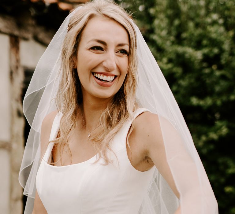 Beautiful bride with half up half down wedding hair and veil 