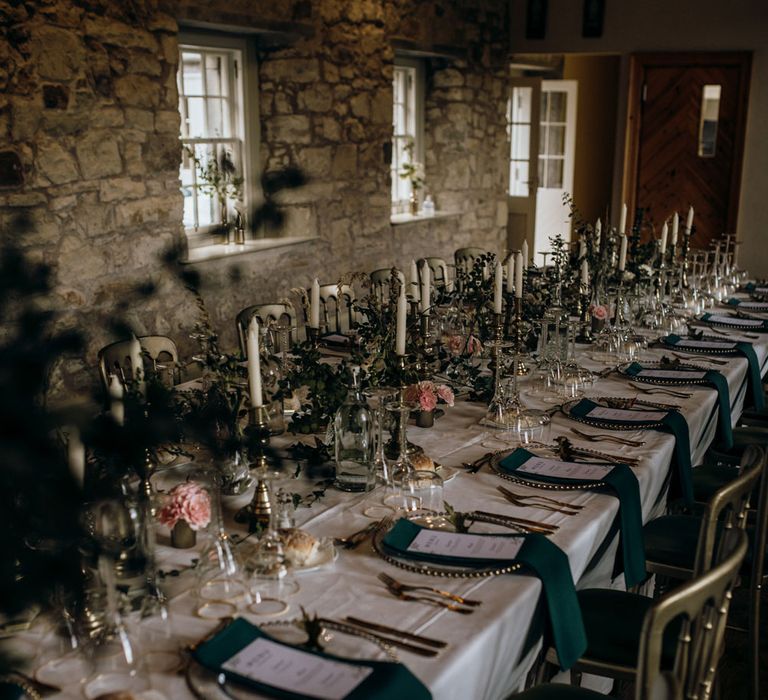 Rustic boho barn wedding table settings with green chairs and pink roses