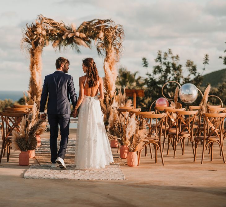 Outdoor boho ceremony in Ibiza with Marylise Bridal gown 