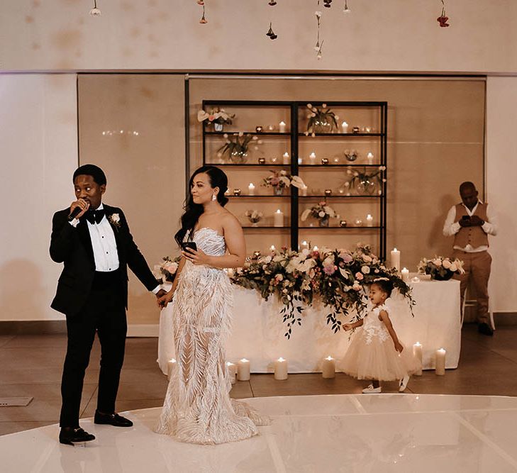 Bride and groom standing on the dance floor delivering their wedding speeches together 