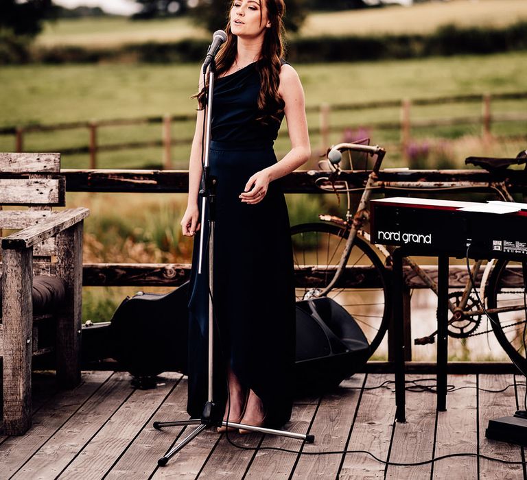 Wedding singer during outdoor ceremony