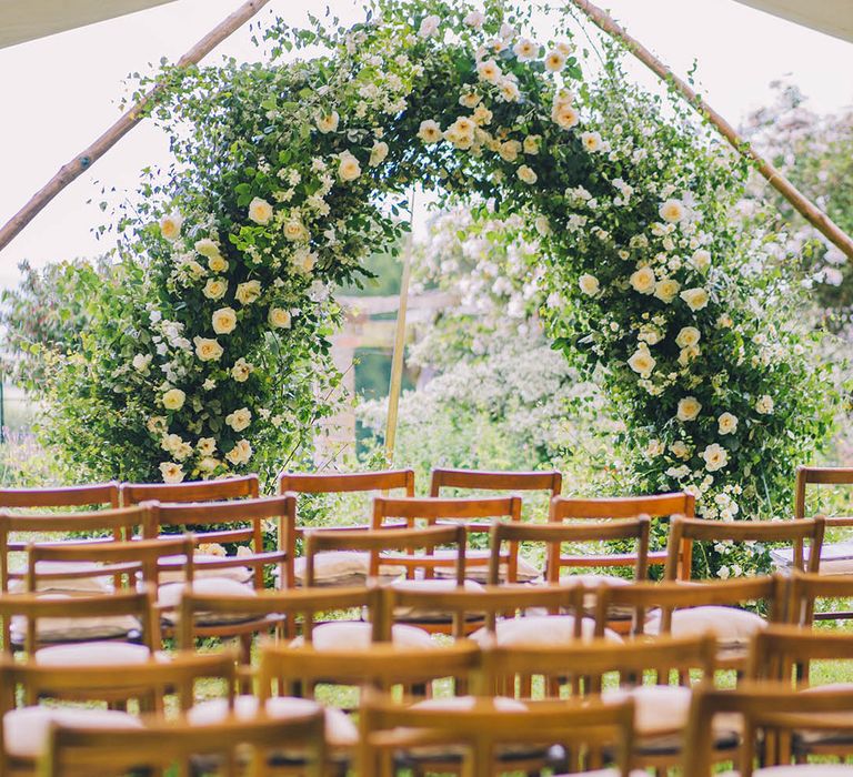 Altar style of large white flower and greenery wedding display for outdoor ceremony 