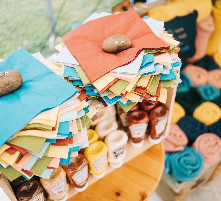 Colourful napkins with stone holder with painted eyes 