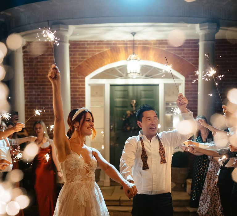 Bride & groom dance through sparkler exit at Reymerston Hall