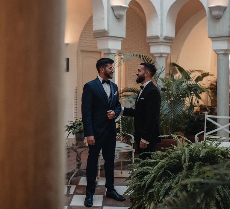 Black tie wedding with grooms in tuxedos at Hotel Cortijo Bravo wedding 