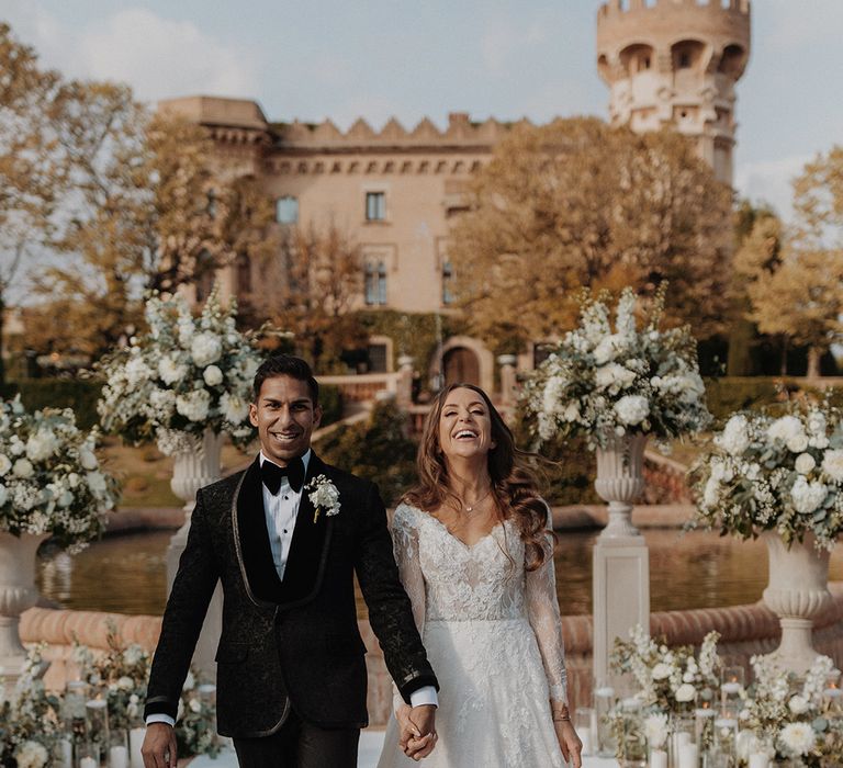 Bride and groom walking down the aisle at multicultural Indian-Irish 3-day destination wedding in Barcelona 