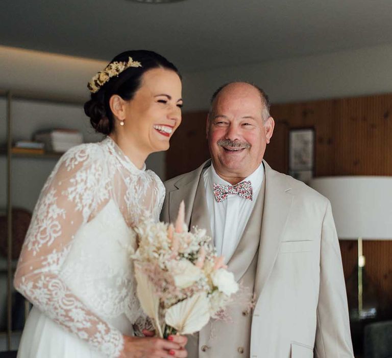 Fist Look Father of the bride moment with dad in a three-piece wedding suit and bride in a boho wedding dress