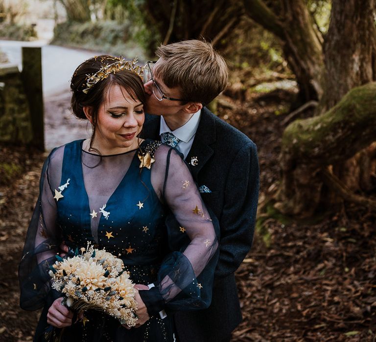 Navy blue wedding dress for the bride with dried flower wedding bouquet 