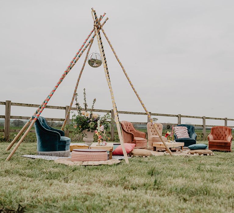 Hardwick Moat Weddings outdoor wedding ceremony with wooden altar decoration and seating area 