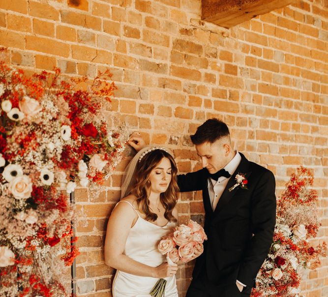 Dramatic Feel Wedding Photography with Red and White Flower Installation