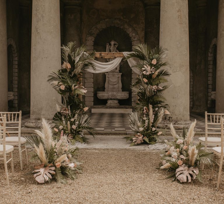 Aisle and altar floral decor at Wotton House with tropical wedding flowers 