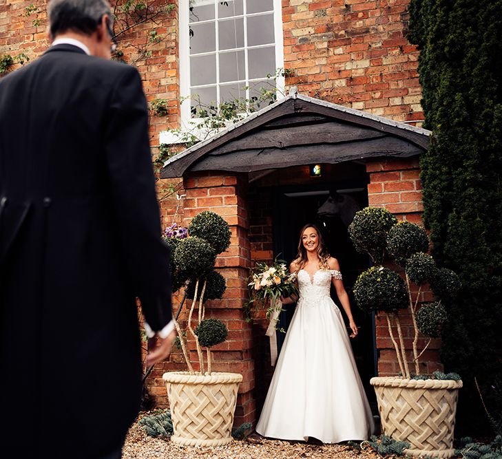 Bride seeing father of the bride before her wedding day