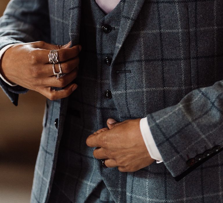 The groom's dapper blue grey check suit from Dandy Threads