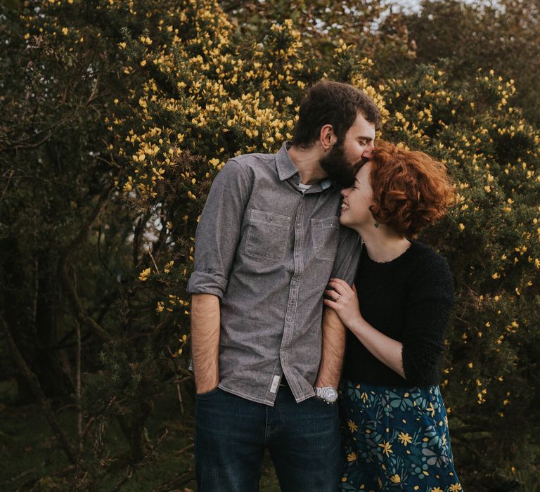 Couple hold each other during engagement session