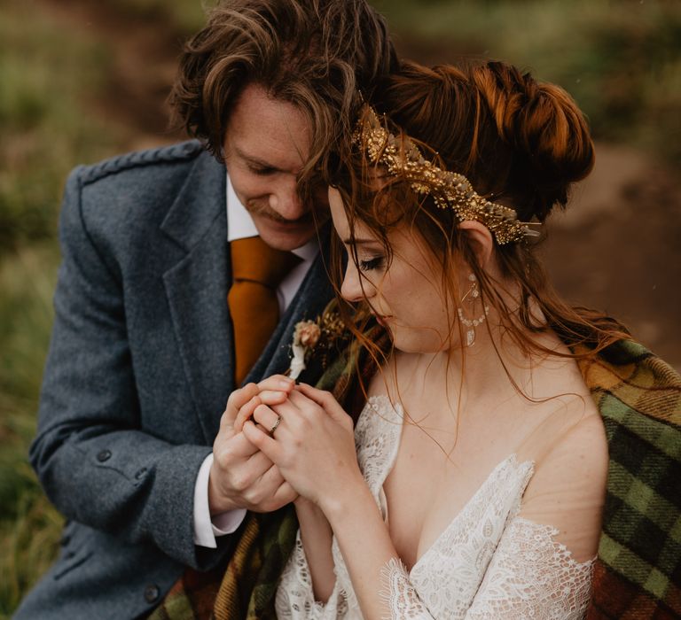 Bride & groom hold one another's hands during elopement