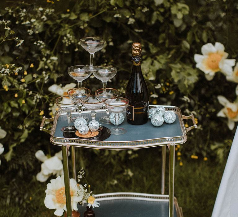 gold hostess trolley with a coupe champagne tower 