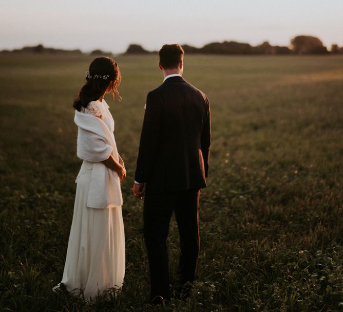 Golden hour portrait with bride in a cream wool wrap bridal cover up 