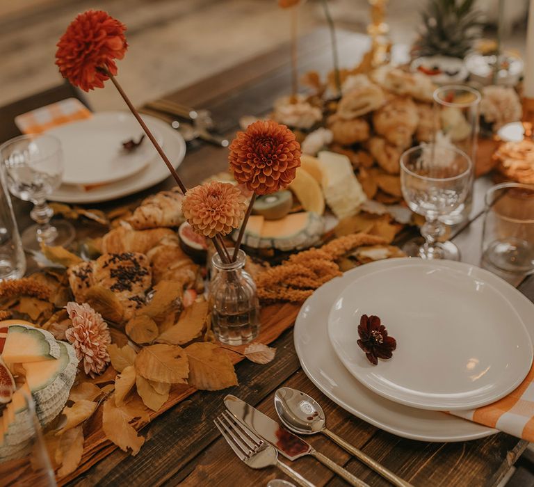 Grazing table wedding centrepiece decor and food and pompom dahlias in bottles 