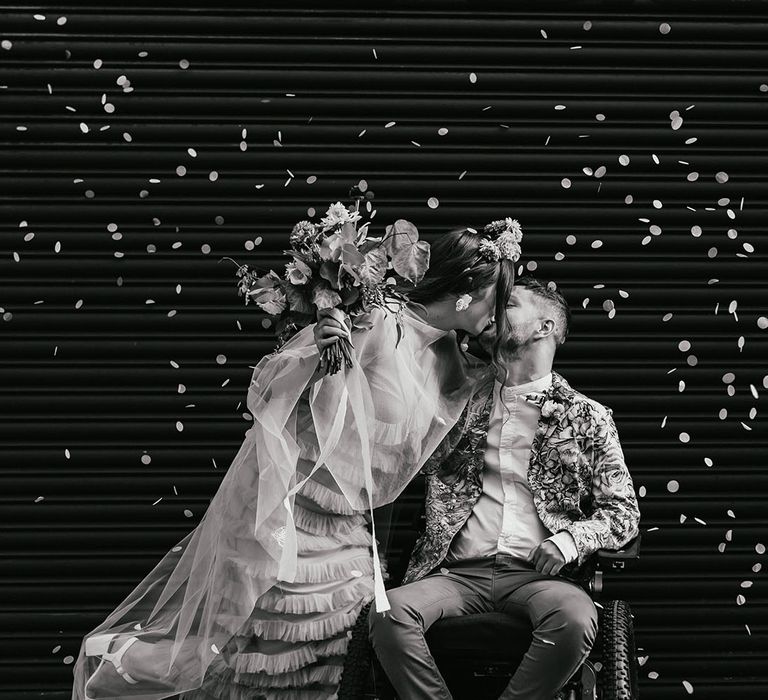 Black and white confetti moment wedding captured on interabled couple