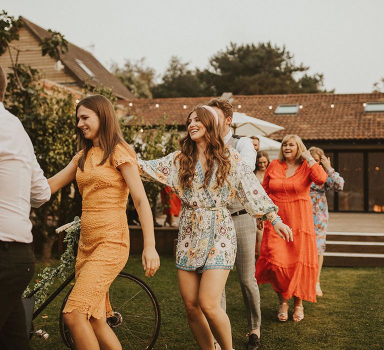 Wedding guests do the conga around East Afton Farmhouse venue