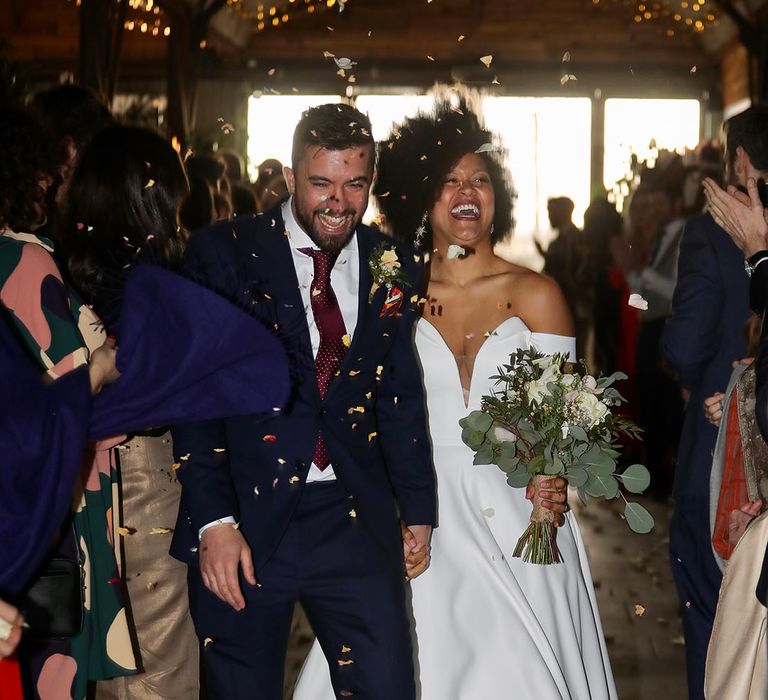 Bride & groom leave wedding ceremony