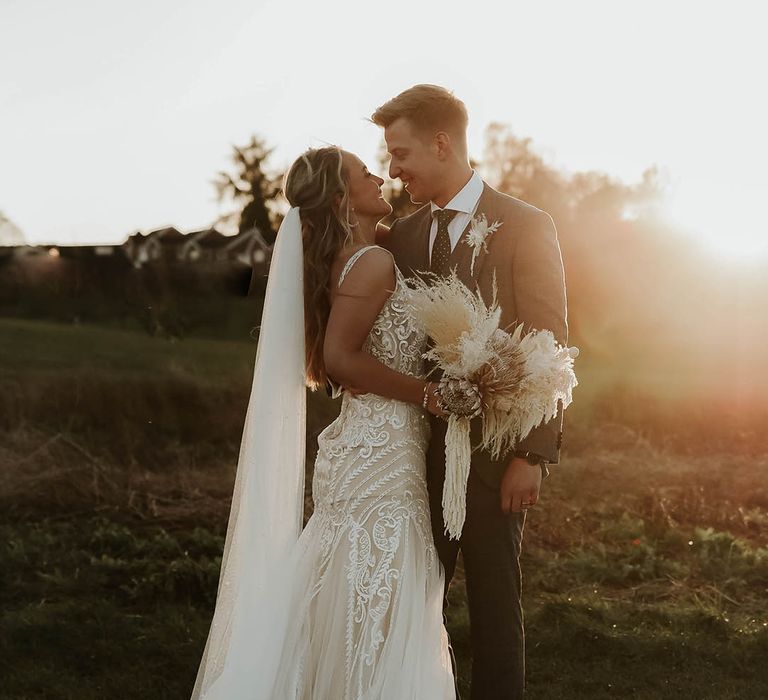 Golden hour wedding portraits for bride and groom