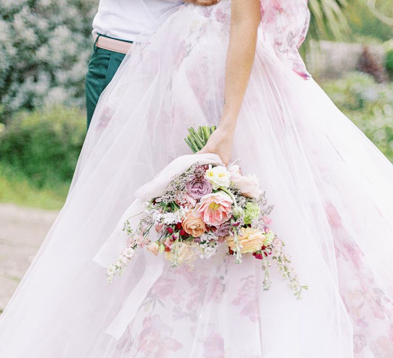 pink floral wedding dress and wedding bouquet 