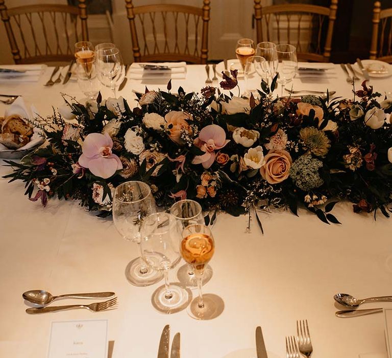 Large mixed neutral coloured floral tablescape display at wedding in Petersham Hotel 